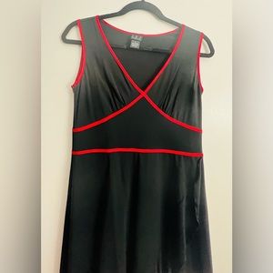 Knit dress. Blk w/ red silk trim in bodice. Bias ruffle from bodice and hem line